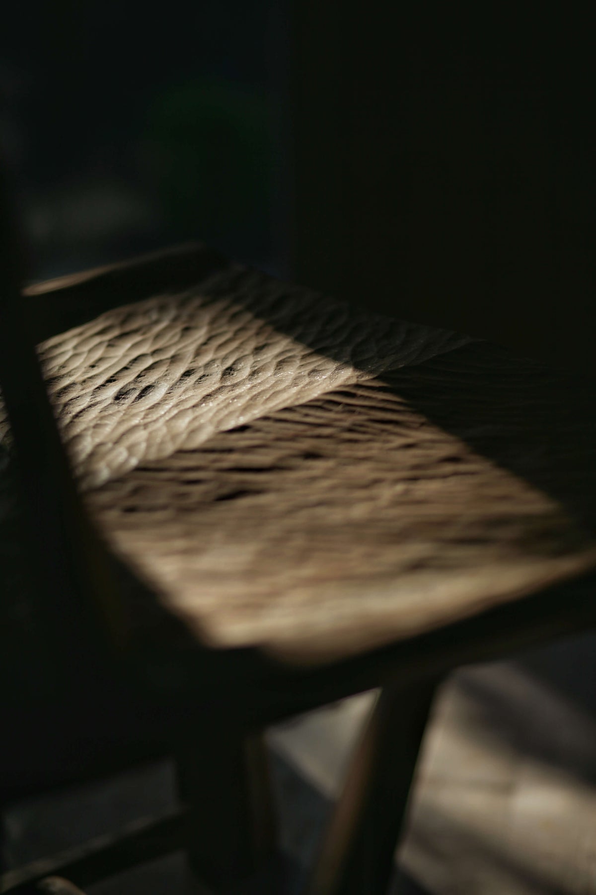 Windsor chair with hand chiseled details on the seat. 